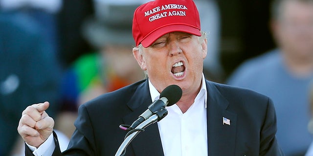 FILE - In this Feb. 28, 2016, file photo, Republican presidential candidate Donald Trump speaks during a rally in Madison, Ala. Republican presidential front-runner Trump has staked out uncompromising positions on Asia policy that could potentially strain U.S. relations with the region if he wins the White House. He says China is ripping off America in trade and should be slapped with a fat import tax. And he claims U.S. military allies Japan and South Korea are freeloading and need to pull their weight. The pan-Pacific trade pact negotiated by the Obama administration is a "total disaster." (AP Photo/John Bazemore, File)
