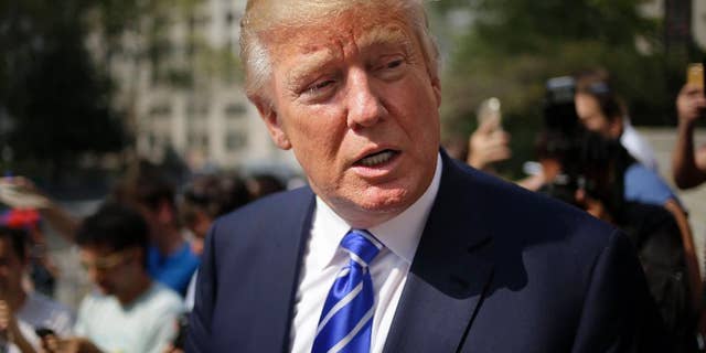 Republican presidential candidate Donald Trump leaves the courthouse after serving on jury duty in New York, Monday, Aug. 17, 2015. The Republican presidential candidate reported for jury duty in Manhattan on Monday and spent much of the day like everyone else, filling out forms and wondering whether he would get picked. (AP Photo/Seth Wenig)