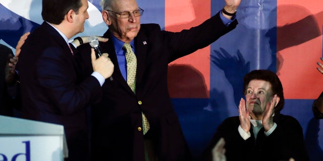 FILE - In this Feb. 1, 2016 file photo, Republican presidential candidate, Sen. Ted Cruz, R-Texas greets his father Rafael as his mother Eleanor Darragh applauds during a rally in Des Moines, Iowa. Republican front-runner Donald Trump rehashed claims Tuesday that his rival Ted Cruzs father has links to President John F. Kennedys assassin Lee Harvey Oswald. (AP Photo/Chris Carlson, File)