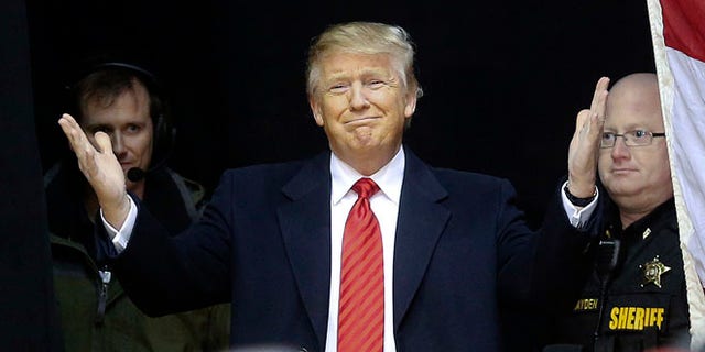 FILE -- Republican presidential candidate Donald Trump reacts as he steps on stage for a rally at Clemson University Wednesday, Feb. 10, 2016, in Pendleton, S.C.