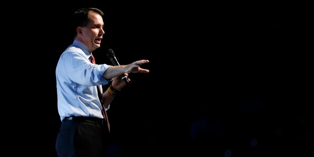 FILE- In this June 27, 2015, file photo, Republican Wisconsin Gov. Scott Walker speaks at the Western Conservative Summit, hosted by the Centennial Institute, Colorado Christian University's think tank, in Denver. Walker, who is to enter the 2016 Republican presidential contest on Monday, July 13, has a national profile largely due to his clashes with labor unions. (AP Photo/Brennan Linsley, File)