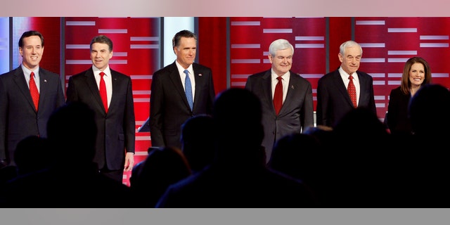 Former Pennsylvania Sen. Rick Santorum, Texas Gov. Rick Perry, former Massachusetts Gov. Mitt Romney, former Speaker of the House Newt Gingrich, Rep. Ron Paul, R-Texas, and Rep. Michele Bachmann, R-Minn, prior to their Republican debate, Saturday, Dec. 10, 2011, in Des Moines, Iowa.