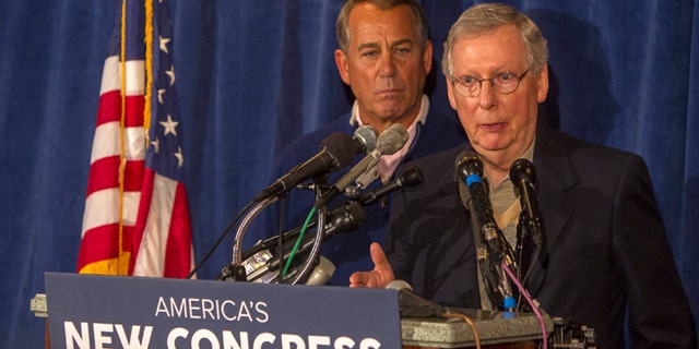 House Speaker John Boehner, left, and Senate Majority Leader Mitch McConnell meet with the press at the GOP retreat at the Hershey Lodge in Hershey, Pa., Thursday, Jan. 15, 2015. (AP Photo/PennLive.com, Mark Pynes )