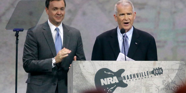 April 10, 2015: Retired Marine Lt. Col. Oliver North, right, speaks at the National Rifle Association convention in Nashville, Tenn.