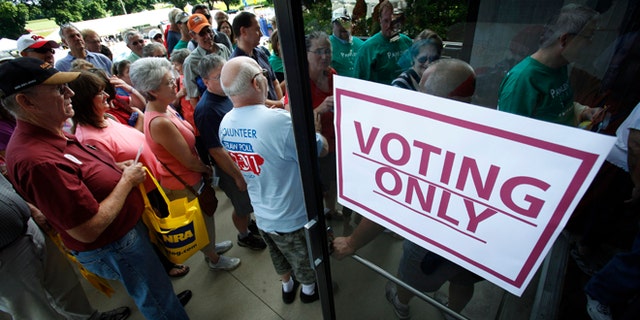 Aug. 13, 2011: Republicans enter Hilton Coliseum in Ames, Iowa, before casting their ballots in the Iowa Republican Party's straw poll.