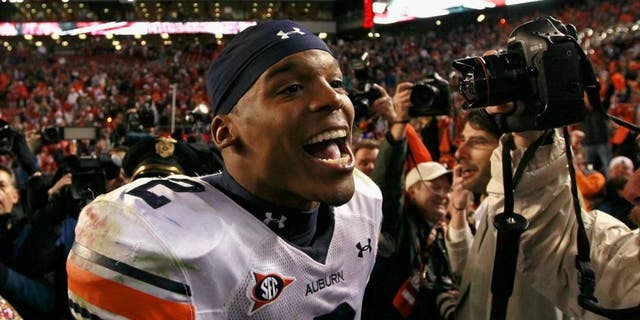 TUSCALOOSA, AL - NOVEMBER 26: Quarterback Cam Newton #2 of the Auburn Tigers celebrates their 28-27 win over the Alabama Crimson Tide at Bryant-Denny Stadium on November 26, 2010 in Tuscaloosa, Alabama. (Photo by Kevin C. Cox/Getty Images)