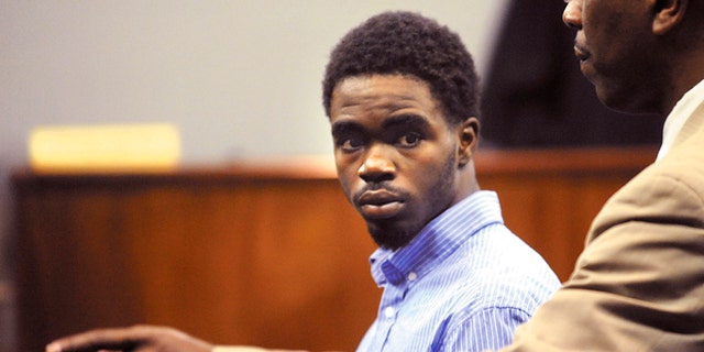 March 25, 2013: A Glynn County Sheriff's Deputy directs 17 year-old De Marquise Elkins out of the courtroom in the Glynn County Courthouse in Brunswick, Ga. after Elkin's first appearance hearing in Magistrate Court.