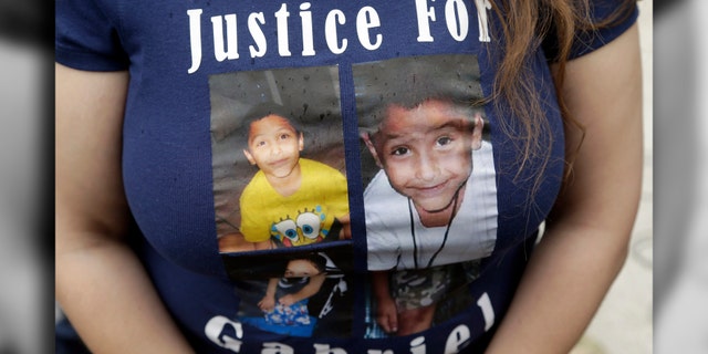 In this April 7, 2016, file photo, a friend of the family of Gabriel Fernandez wears a shirt with his likeness.