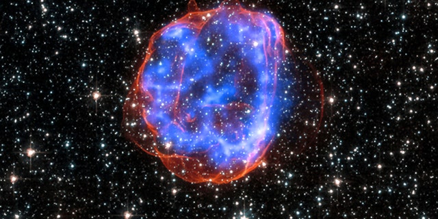 File photo - an expanding shell of debris called SNR 0519-69.0 is left behind after a massive star exploded in the Large Magellanic Cloud, a satellite galaxy to the Milky Way.