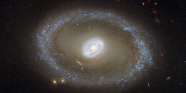 A galaxy known as NGC 3081 located over 86 million light-years from Earth is seen in an undated NASA/ESA Hubble Space Telescope image.