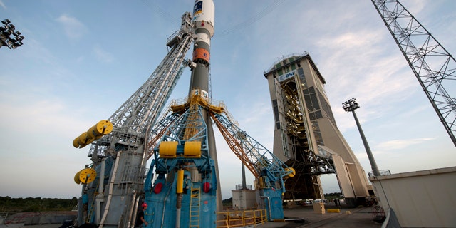 Oct. 14, 2011: Soyuz VS01, the first Soyuz flight from Europes Spaceport in French Guiana, sits on the launchpad awaiting the green light to lift off.The vehicle was rolled out horizontally on its erector from the preparation building to the launch zone and then raised into the vertical position. The Upper Composite, comprising the Fregat upper stage, payload and fairing, was also transferred and added onto the vehicle from above, completing the very first Soyuz on its launch pad at Europes Spaceport.Soyuz VS01 will lift off on 20 October 2011. The rocket will carry the first two satellites of Europes Galileo navigation system into orbit.