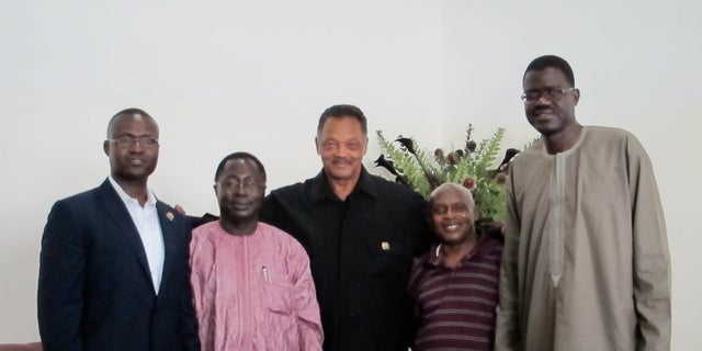 Rev. Jesse Jackson, Sr. pictured with Gambian officials.