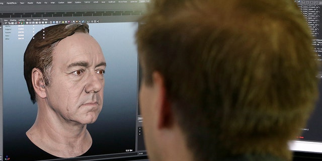 This July 31, 2014 photo shows senior technical artist Mason Sheffield working on the face of actor Kevin Spacey for the new "Call of Duty: Advanced Warfare" game at Sledgehammer Games in Foster City, Calif.