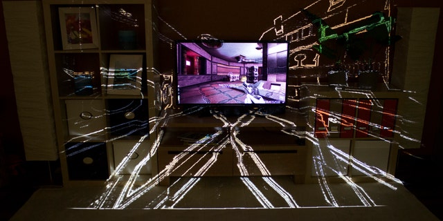 The IllumiRoom project, a proof-of-concept system combining a projector and sensor to project visualizations and augment areas surrounding a TV screen.
