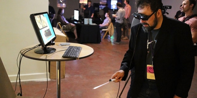 Sept. 20, 2013: TextFiles.com founder and owner Jason Scott using the CastAR augmented reality 3D glasses in Portland, Ore.