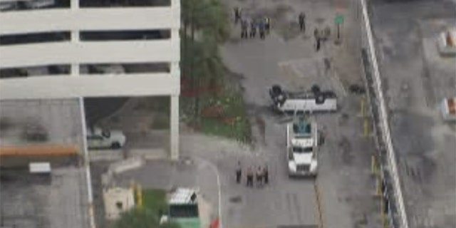 The driver, said to be an American Airlines employee in his 50s, reportedly escaped with only minor injuries.