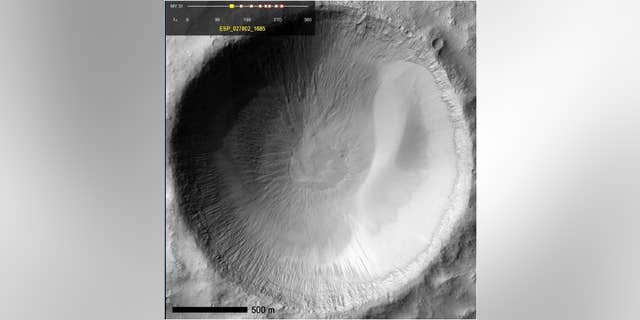 Recurring slope lineae (RSL) seep in Garni crater on the floor of Mars' Melas Chasm.