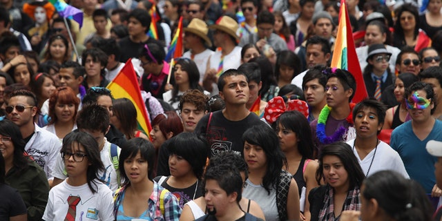 MEXICO CITY, MEXICO - JUNE 30: Thousands of people fill Mexico City's Paseo de la Reforma during a gay pride march on June 30, 2012 in Mexico City, Mexico. Mexicans go the polls Sunday for presidential elections. (Photo by John Moore/Getty Images)