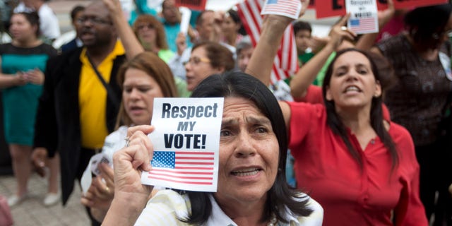 July 2, 2014: Anti-gay marriage protesters stage a rally during the court hearing on gay marriage in Miami.