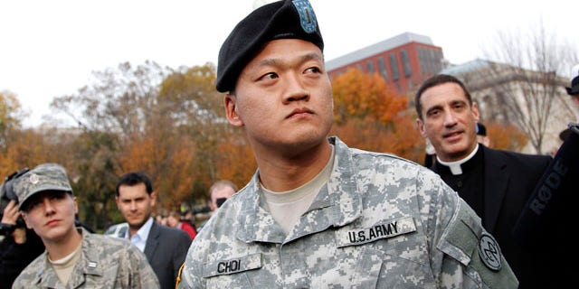 Nov. 15: Lt. Dan Choi, center, is seen in front of the White House in Washington, D.C., moments before he handcuffed himself to the fence of the White House during a protest for gay rights. (AP)
