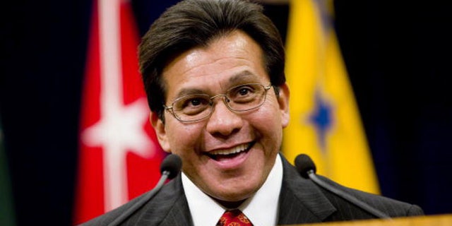 US Attorney General Alberto Gonzales speaks during a farewell ceremony in his honor.