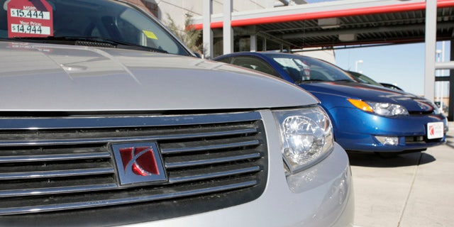 November 19, 2006: Unsold 2006 Ion coupes sit outside a Saturn dealership in the south Denver suburb of Highlands Ranch, Colo. According to government documents released Saturday, General Motors waited years to recall nearly 335,000 small cars for power steering failures despite getting thousands of consumer complaints and more than 30,000 warranty repair claims. (AP Photo/David Zalubowski)