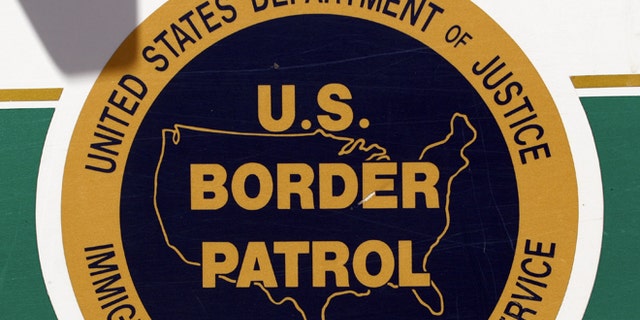 NOGALES, AZ - MAY 14: The U.S. Border Patrol emblem is seen on the side of an agent's truck patrolling the border May 14, 2006 in Nogales, Arizona. U.S. President George W. Bush will address the nation on the immigration issue May 15. (Photo by Jeff Topping/Getty Images)