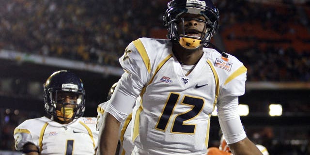 January 4, 2012: West Virginia quarterback Geno Smith celebrates a touchdown during the first half of the Orange Bowl NCAA college football game against Clemson in Miami.
