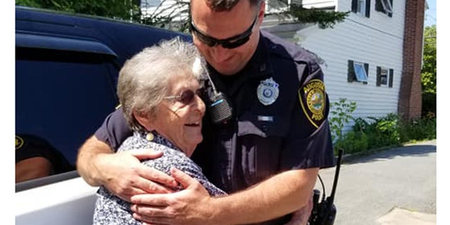 Simone “wondered what it was like to be arrested and sit in the back seat.” She now refers to the patrol car’s owner, Officer Paul Doody (right) as “her cop.” (Anne Dumont)