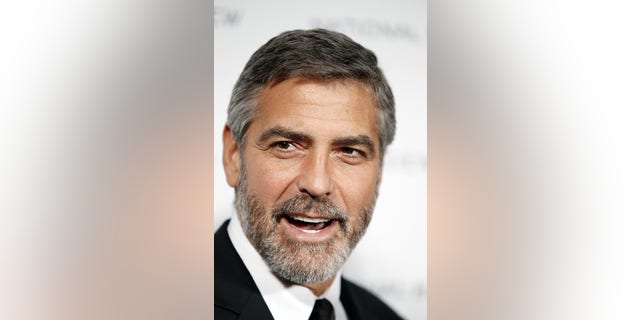Actor George Clooney arrives to accept the award for Best Actor for his role in "Up In The Air" at the National Board of Review Award ceremony in New York in this January 12, 2010 file photo. Clooney was nominated for best actor for his role in the film "Up in the Air" for the 82nd Academy Awards, announced February 2, 2010. The Oscars will be presented in Hollywood March 7, 2010. REUTERS/Lucas Jackson/Files (UNITED STATES - Tags: ENTERTAINMENT HEADSHOT)