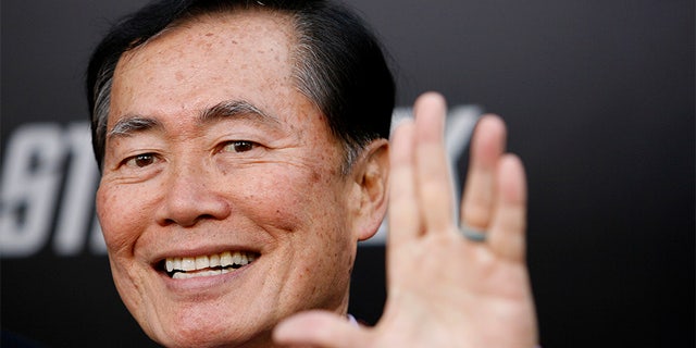 Actor George Takei gestures at the premiere of the movie "Star Trek" at the Grauman's Chinese theatre in Hollywood, California April 30, 2009. The movie opens in the U.S. on May 8. REUTERS/Mario Anzuoni (UNITED STATES ENTERTAINMENT) - GM1E55110TE01