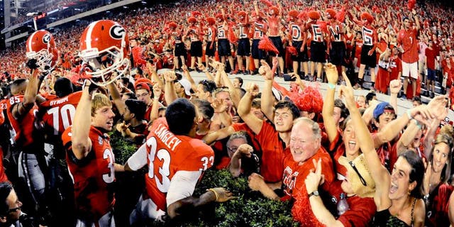 Aug 30, 2014; Athens, GA, USA; Georgia Bulldogs players and fans react after defeating the Clemson Tigers at Sanford Stadium. Georgia defeated Clemson 45-21. Mandatory Credit: Dale Zanine-USA TODAY Sports