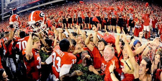 Aug 30, 2014; Athens, GA, USA; Georgia Bulldogs players and fans react after defeating the Clemson Tigers at Sanford Stadium. Georgia defeated Clemson 45-21. Mandatory Credit: Dale Zanine-USA TODAY Sports