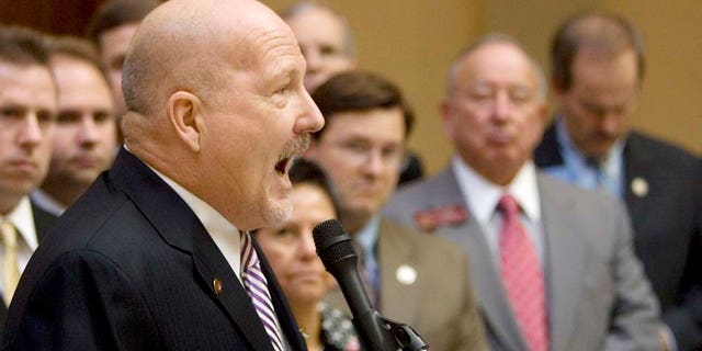 FILE - In a Jan 12, 2009 file photo, D.A. King, head of the Dustin Inman Society, speaks during a news conference as several members of the Georgia General Assembly look on at the Capitol in Atlanta. For nearly a decade, King has pushed for stricter enforcement of immigration laws. With a sometimes confrontational approach, he’s won a lot of supporters but also a lot of enemies. (AP Photo/John Bazemore, File)