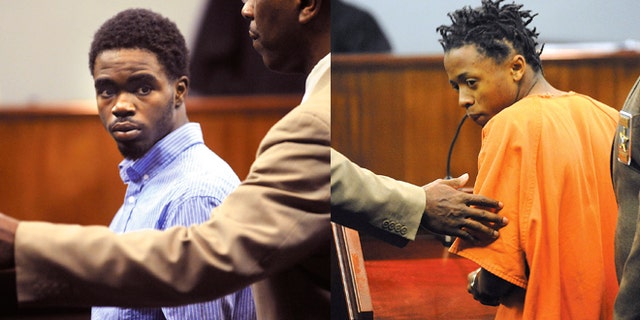 (LEFT) A Glynn County Sheriff's Deputy directs 17 year-old De Marquise Elkins out of the courtroom in the Glynn County Courthouse in Brunswick, Ga. (RIGHT) A Glynn County Sheriff's Deputy directs 15 year-old Dominique Lang out of the courtroom in the Glynn County Courthouse in Brunswick, Ga.