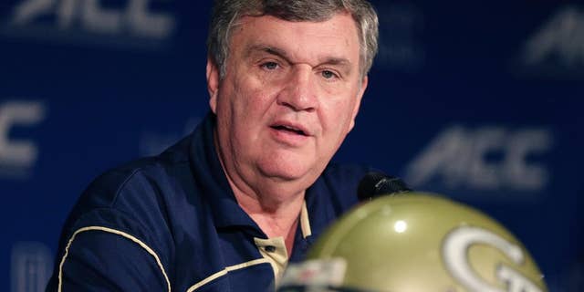 FILE - In this July 21, 2014, file photo, Georgia Tech head coach Paul Johnson answers a question during a news conference at the Atlantic Coast Conference Football kickoff in Greensboro, N.C. Johnson points to a string of high finishes in the ACC's Coastal Division as proof criticism of his program is unwarranted. Still, the Yellow Jackets enter 2014 looking to improve on back-to-back seven-win finishes, to finish in the Top 25 for the first time since 2009 and to end a streak of five straight losses to state rival Georgia. (AP Photo/Chuck Burton, File)