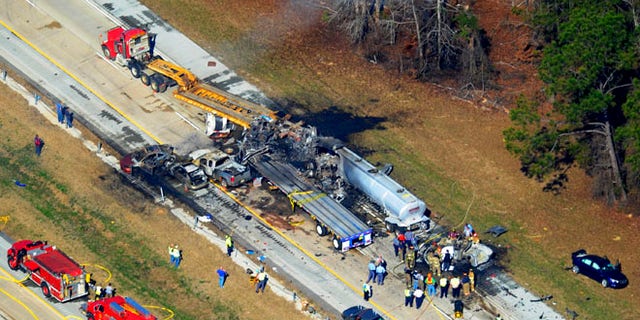 Feb. 6, 2013: Emergency workers and firemen are at he scene of a pile up on Interstate 16 near Jeffersonville, Ga.