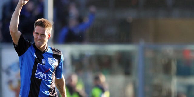 Atalanta's German Denis, of Argentina, reacts after scoring during a Serie A soccer match against AS Roma in Bergamo, Italy, Sunday, Feb. 26, 2012. (AP Photo/Felice Calabro')
