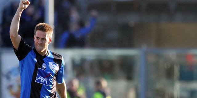 Atalanta's German Denis, of Argentina, reacts after scoring during a Serie A soccer match against AS Roma in Bergamo, Italy, Sunday, Feb. 26, 2012. (AP Photo/Felice Calabro')