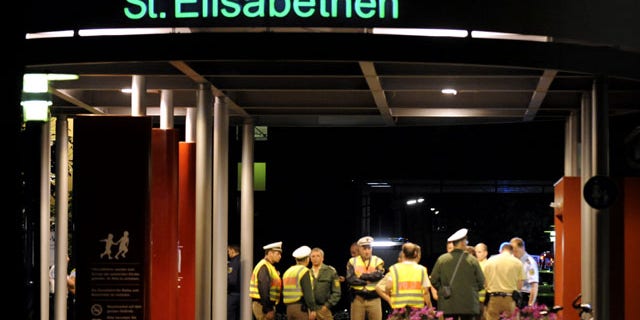 September 19: Police officers guard the entrance of the St. Elisabethen hospital in Loerrach, southern Germany. (AP)