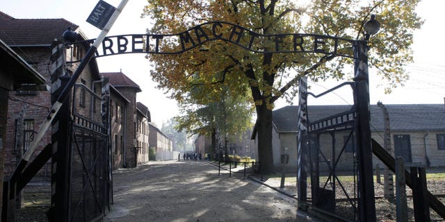 Oct. 19, 2012 - FILE photo of the entrance gate of the former German Nazi death camp of Auschwitz with the inscription "Arbeit Macht Frei (Work Sets You Free)" at the Auschwitz-Birkenau memorial in Oswiecim, Poland. 94-year-old Hans Lipschis, deported from the U.S. for lying about his Nazi past, is unfit for trial on allegations he was an accessory to thousands of murders as an SS guard at Auschwitz, a German court said Friday.