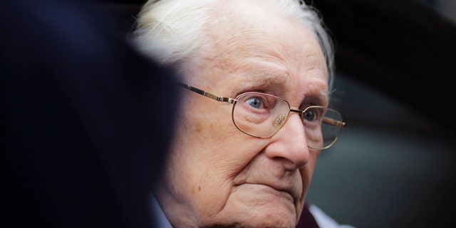 July 15, 2015: Former SS sergent Oskar Groening arrives for the judgement at the trial against him in in Lueneburg, Germany. Groening, 94, who is accused of helping to operate the death camp Auschwitz between May and June 1944, has been convicted on 300,000 counts of accessory to murder. The state court gave Groening a four-year sentence. (AP Photo/Markus Schreiber)