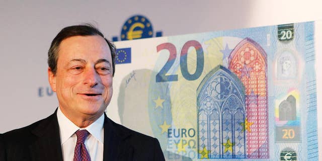 FILE - In this Tuesday, Feb. 24, 2015, file photo, Mario Draghi, president of the European Central Bank, stands next to a facsimile of the new 20 euro banknote in Frankfurt, Germany. Analysts are already talking about when and how the European Central Bank might extend its 1.1 trillion euro ($1.2 trillion) stimulus program that has been running for the past six months in an attempt to boost the modest recovery in the 19 countries that use the euro. (AP Photo/Michael Probst, File)