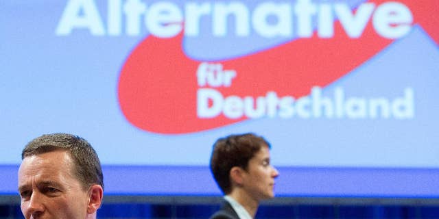 In this July 4, 2015 picture Alternative fuer Deutschland party co-chairs Bernd Lucke , left, and Frauke Petry attend the party conference in Essen, Germany. The upstart Alternative for Germany party has replaced its euroskeptic leader with a conservative from the east who wants to place greater emphasis on immigration. A majority of AfD members backed Frauke Petry in the leadership vote Saturday against Bernd Lucke, who led the party during its successful bids in the past two years to enter the European Parliament and five German state assemblies.(Frederico Gambarini/dpa via AP))