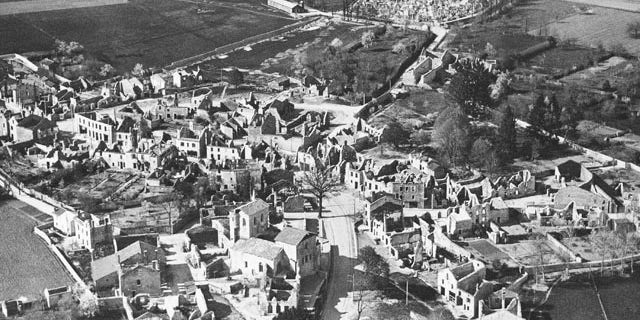 FILE - In this Jan. 1, 1953 b/w file picture, an aerial view of the destroyed Oradour-sur-Glane, in France is visible. In total, 642 men, women and children were killed here in reprisal for the French Resistance's kidnapping of a German soldier. (AP Photo,File)