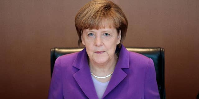 German Chancellor Angela Merkel attends the weekly cabinet meeting at the chancellery in Berlin, Wednesday, May 28, 2014.  (AP Photo/Markus Schreiber)