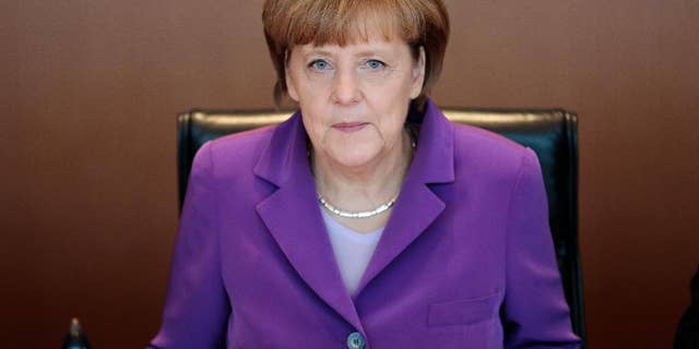 German Chancellor Angela Merkel attends the weekly cabinet meeting at the chancellery in Berlin, Wednesday, May 28, 2014. (AP Photo/Markus Schreiber)