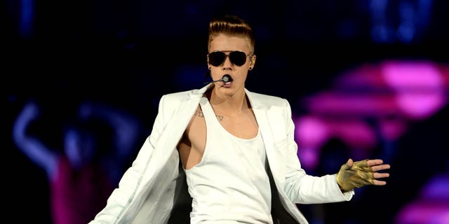 In this picture, made available Saturday April 6, 2013, Canadian singerJustin Bieber performs during a concert in Dortmund, western Germany, Friday April 5, 2013. (AP Photo/dpa,Caroline Seidel)