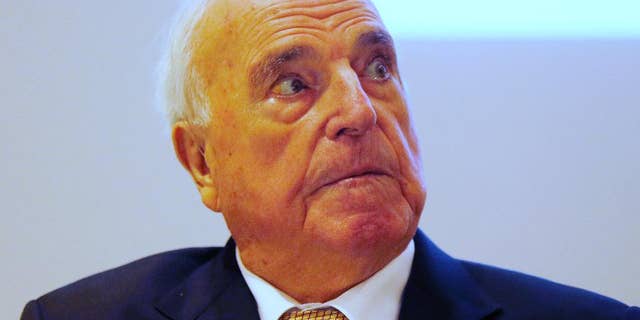 FILE - In this Nov. 3, 2014 file picture fFormer German Chancellor Helmut Kohl looks around before he presents his new book in Frankfurt, Germany. A German court has handed ex-Chancellor Helmut Kohl a victory in his fight with a one-time ghostwriter over his new book Thursday Nov. 13, 2014 . Kohl’s lawyers sought to have 115 quotes from the former leader removed from Heribert Schwan’s “Legacy: The Kohl Records.” It’s based partly on recordings of interviews conducted in 2001 and 2002, when Kohl was under pressure in a party financing scandal, and has drawn attention for unflattering comments about other politicians. (AP Photo/Michael Probst,File)