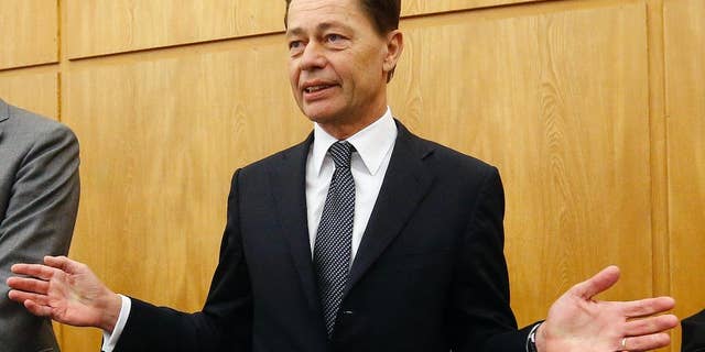 Former Arcandor CEO Thomas Middelhoff gestures in the courtroom of the district court in Essen, Germany, Friday, Nov. 14, 2014. Middelhoff is accused of embezzlement during his work for Arcandor and faces the verdict today. (AP Photo/Frank Augstein)